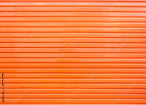 An orange metal door
