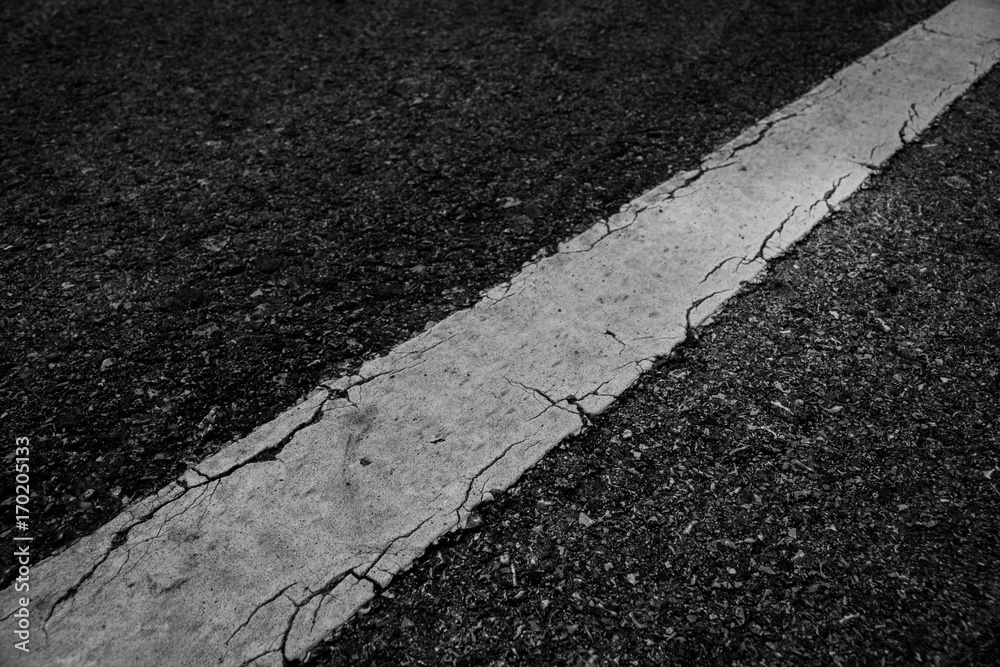 Fototapeta premium Line white old on asphalt black texture background.