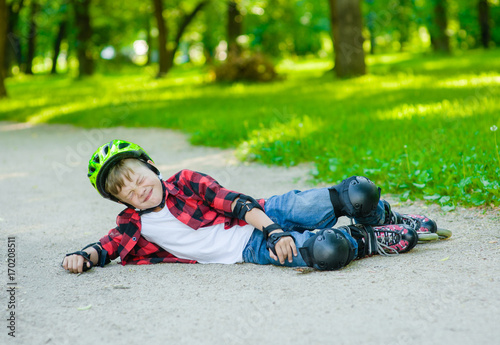 Boy falling on roller skates