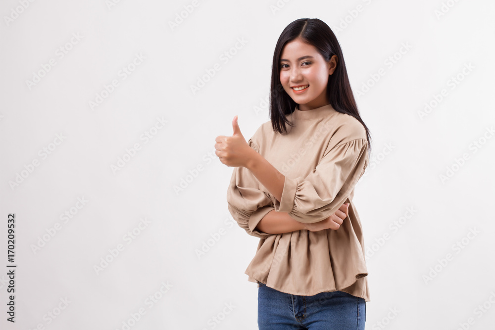 casual woman pointing thumb up to blank space, studio isolated of asian arab woman model casual woman pointing thumb up to blank space, studio isolated of asian arab woman model