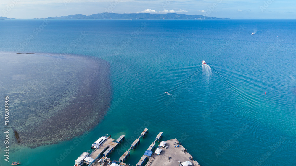 aerial view of Koh Phangan international port with boats in the claear blue sea