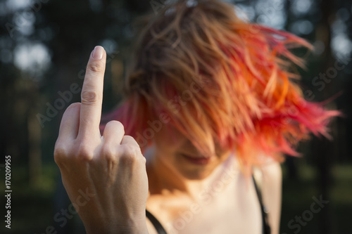 Принти на полотні Red-haired girl showing middle finger gesture