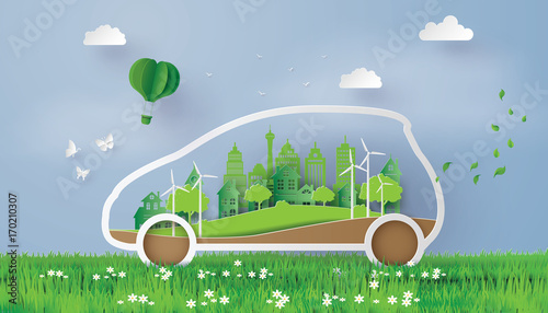 Paper Cut Electric Car in Green Landscape