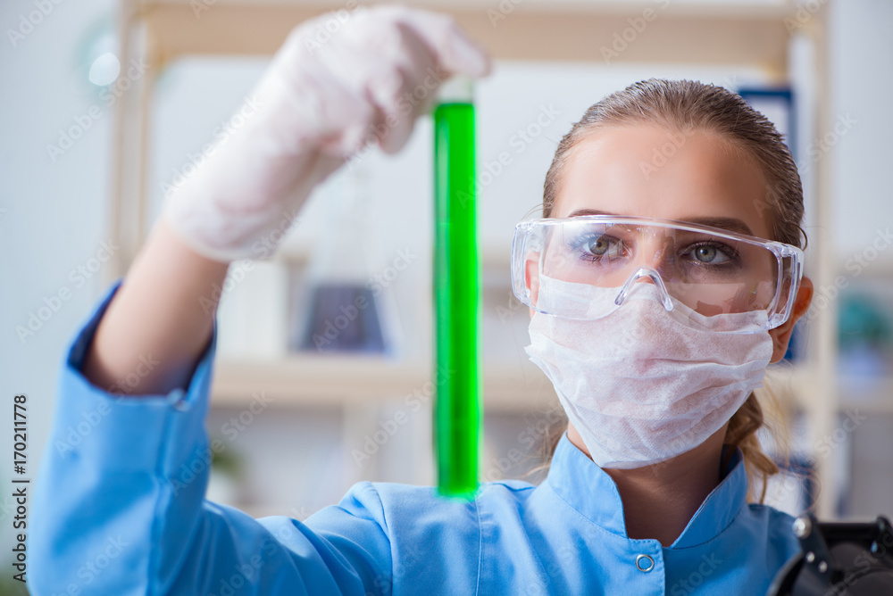Female scientist researcher conducting an experiment in a labora Female scientist researcher conducting an experiment in a labora