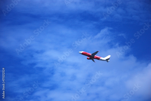 plane take off with blue sky background