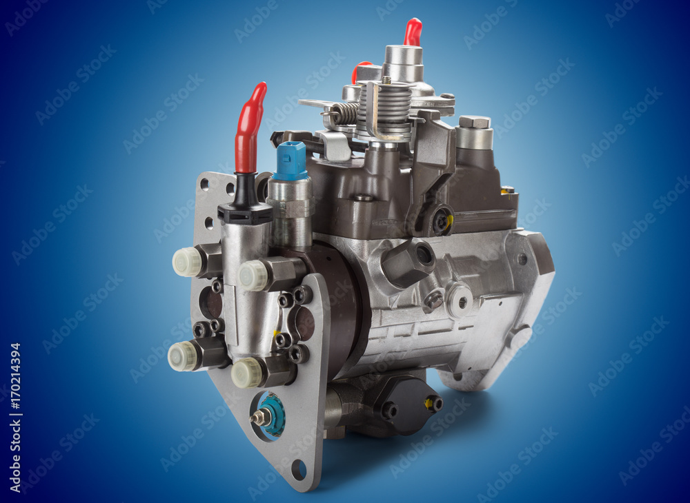 Fototapeta premium Diesel fuel injection pump on blue background.