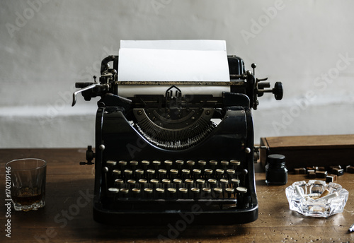 Closeup of retro vintage typewriter on wooden table