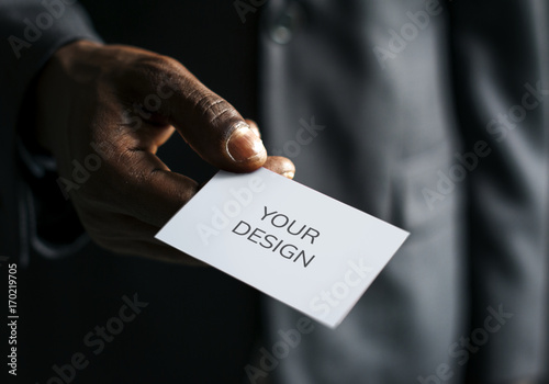 Businessman holding business card