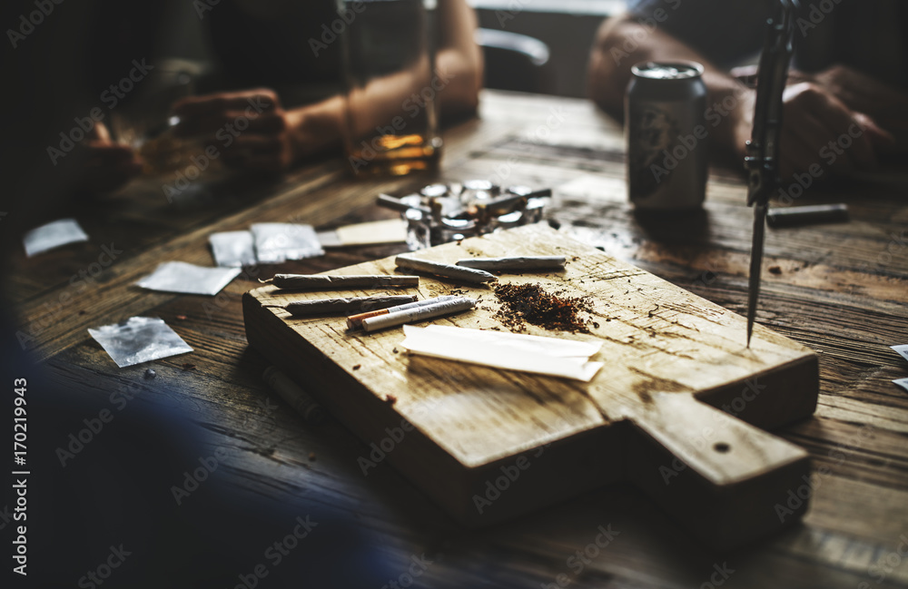 Marijuana is on a wooden cutting board