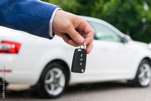 transfer of a car to a new owner for money, ignition keys in the manager's hand