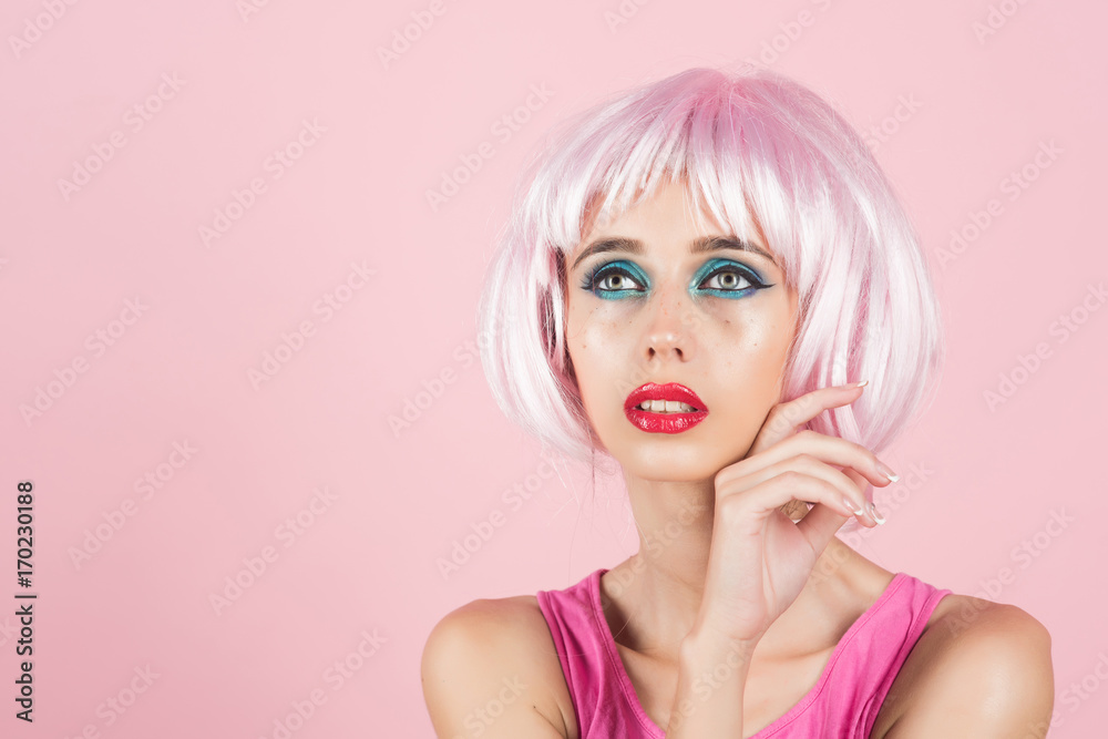 Woman in pink wig with fashionable makeup. Woman in pink wig with fashionable makeup.