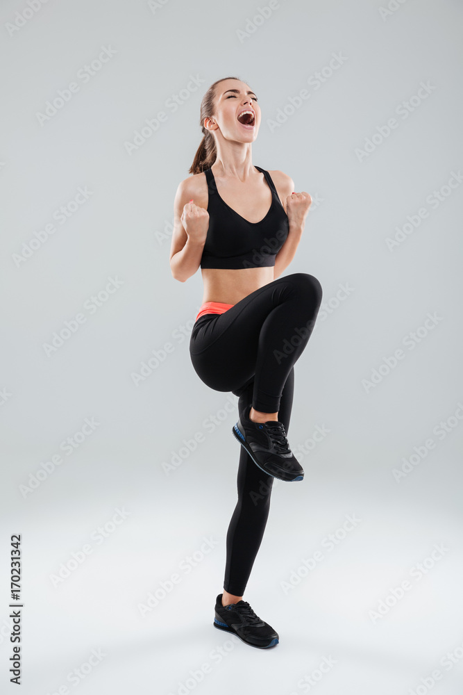 Full length picture of happy screaming fitness woman Full length picture of happy screaming fitness woman