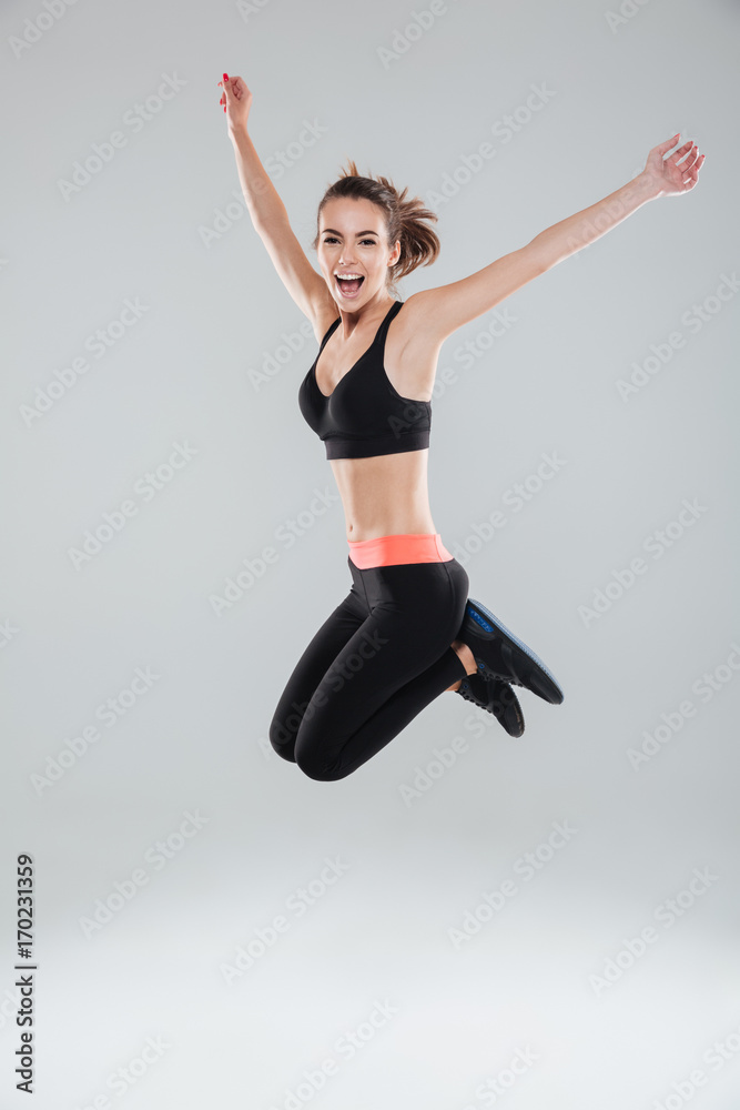 Full length image of happy jumping fitness woman Full length image of happy jumping fitness woman