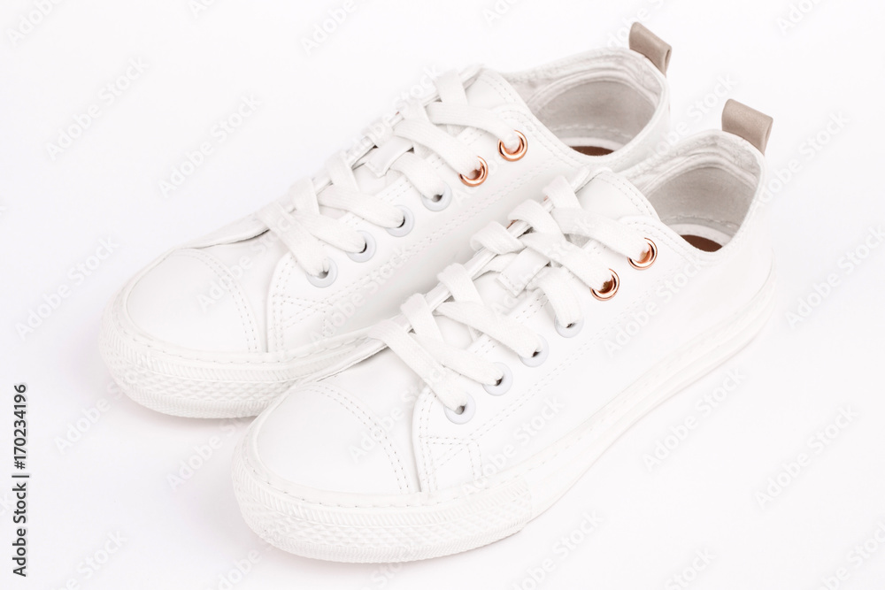 Pair of new white sneakers, isolated on white background Pair of new white sneakers, isolated on white background