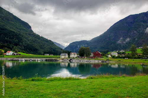 Fishing village between the mountains on the lake in Norway.