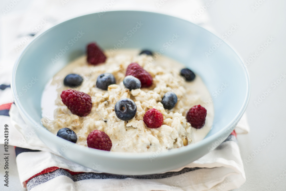 Healthy breakfast - oatmeal with blueberries and raspberries Healthy breakfast - oatmeal with blueberries and raspberries