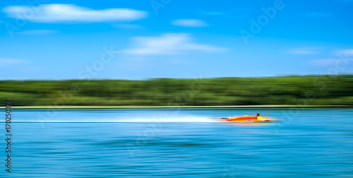 Speed. Speed boats on lake.