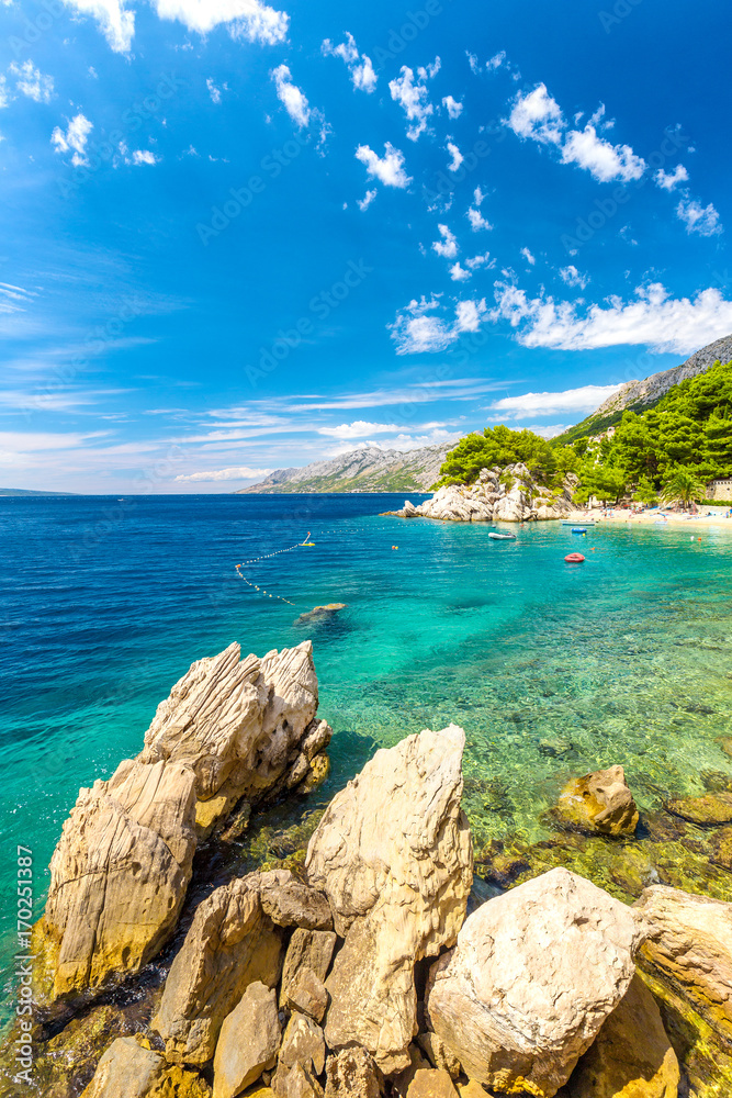 Rocky coast and beach at the Adriatic Sea in Brela resort in Croatia, Europe.