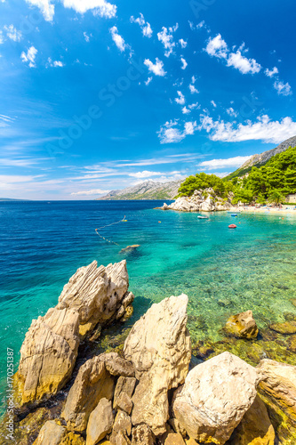 Rocky coast and beach at the Adriatic Sea in Brela resort in Croatia, Europe.