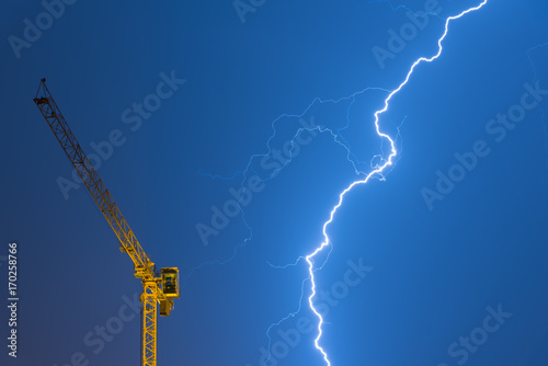 crane struck by lightning, powerful thunderbolt 