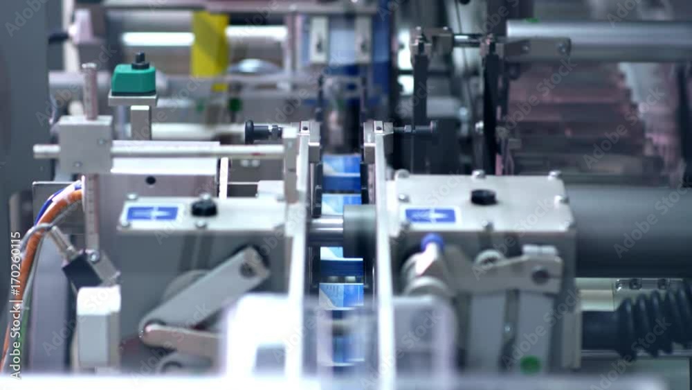 Packaging line at pharmaceutical factory. Pharmaceutical industry. Medical drugs on packaging machine. Pharmaceutical manufacturing packaging process. Pharmaceutical packaging Packaging line at pharmaceutical factory. Pharmaceutical industry. Medical drugs on packaging machine. Pharmaceutical manufacturing packaging process. Pharmaceutical packaging