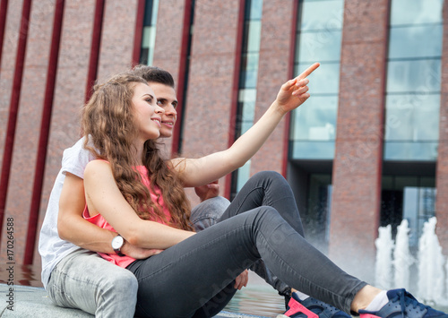 Young couple sitting outdoor and relaxing, happiness concept