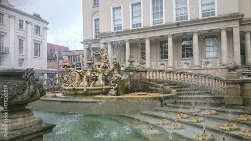 Neptune fountain located in Cheltenham town centre, England  photo