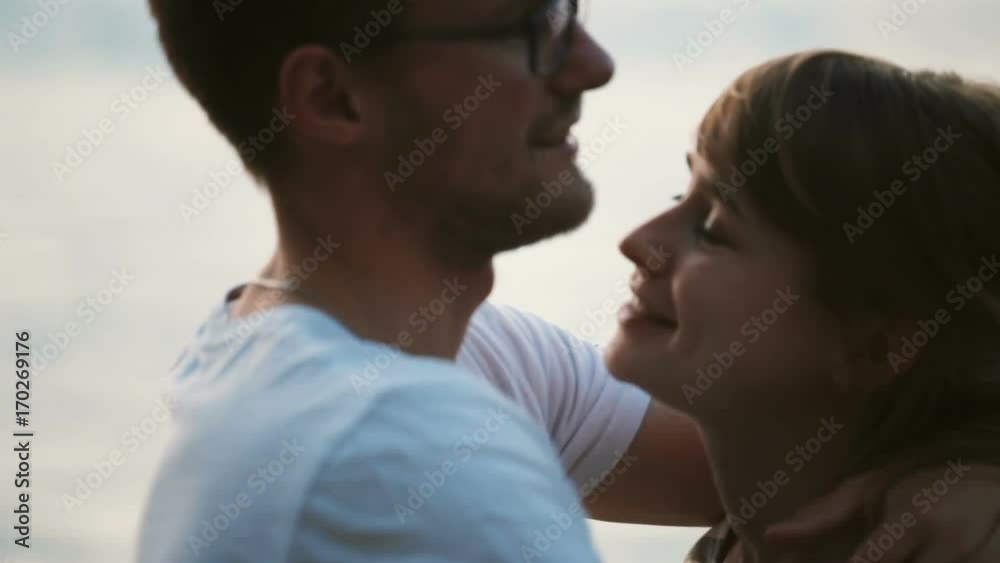 Portrait of young beautiful couple hugging and kissing. Happy man and woman spending time together on the nature. Portrait of young beautiful couple hugging and kissing. Happy man and woman spending time together on the nature.