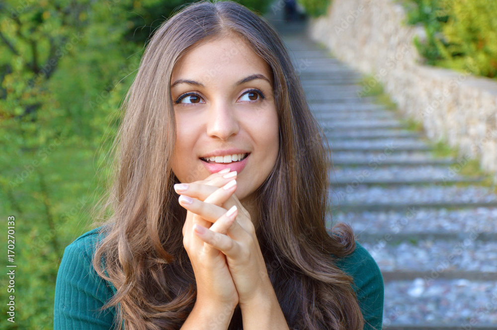 Portrait of happy hopefully gesturing smiling young woman in casual smart green clothing, with copyspace for slogan or text message Portrait of happy hopefully gesturing smiling young woman in casual smart green clothing, with copyspace for slogan or text message