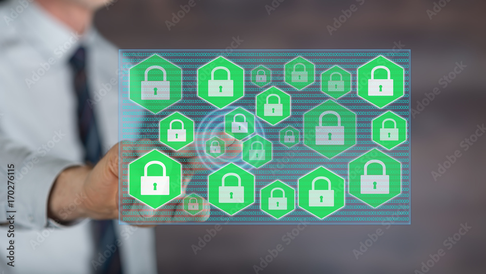 Man touching a data security concept on a touch screen Man touching a data security concept on a touch screen