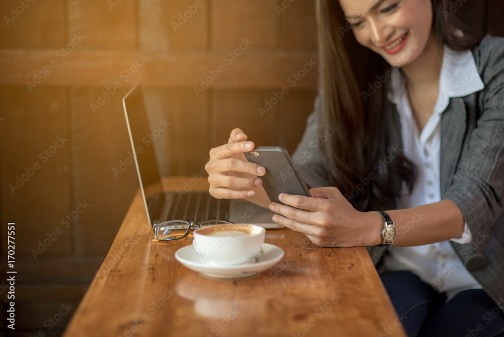 Young business woman checking email on cell during coffee break. Happy for success. Business concept. Young business woman checking email on cell during coffee break. Happy for success. Business concept.