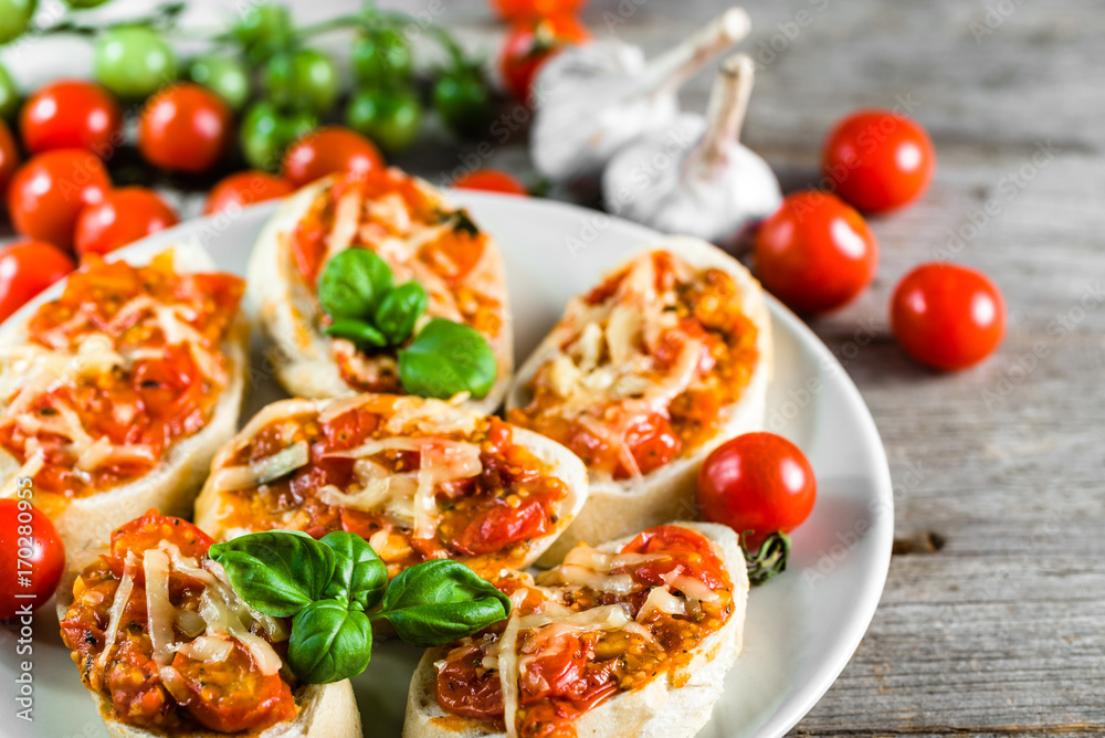 Spicy bruschetta with tomatoes and basil, traditional italian appetizers Spicy bruschetta with tomatoes and basil, traditional italian appetizers