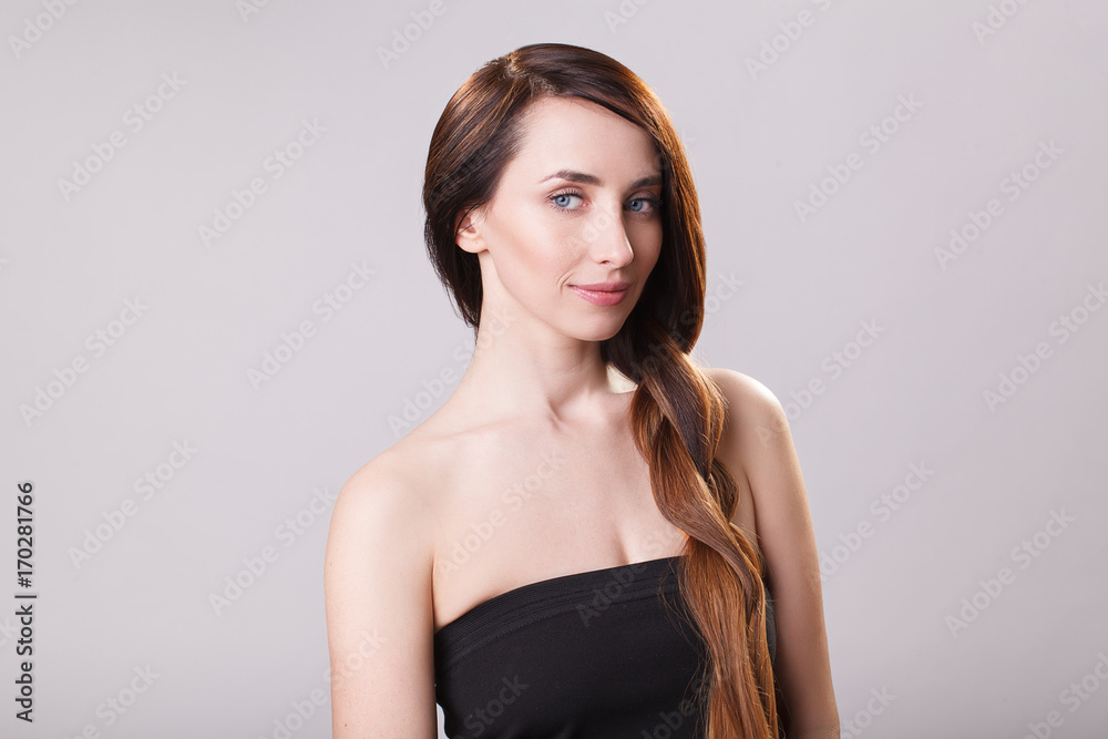 Beautiful Hair. Beauty brunette woman with luxurious long hair and closed eyes over blue background. Makeup. Girl Model girl with Healthy Hair. Beautiful Hair. Beauty brunette woman with luxurious long hair and closed eyes over blue background. Makeup. Girl Model girl with Healthy Hair.