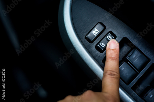 Finger push lock button of car doors.