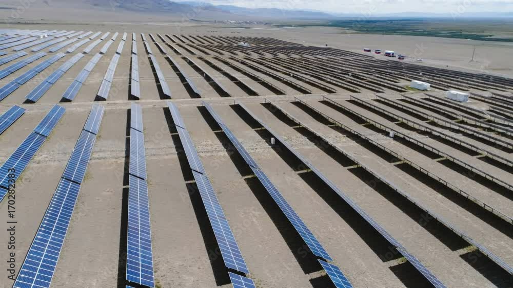 Aerial shot of solar panels - solar power plant. 4k slow motion aerial shot. Aerial shot of solar panels - solar power plant. 4k slow motion aerial shot.