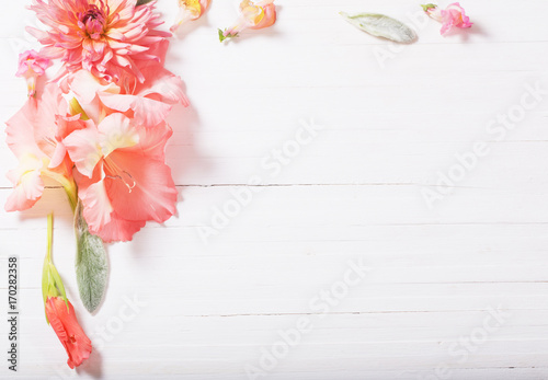 Fototapeta Naklejka Na Ścianę i Meble -  beautiful flowers on white wooden background