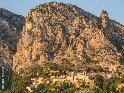 A view of the village of Moustiers-Sainte-Marie, located on a cliff in southern France.