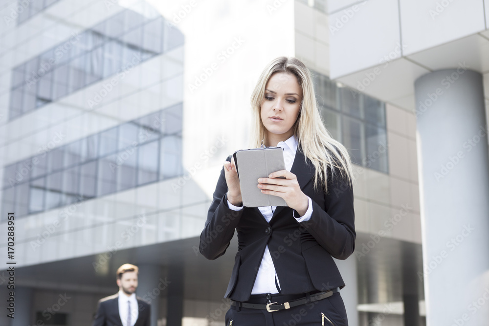 Business woman using digital tablet outdoors Business woman using digital tablet outdoors