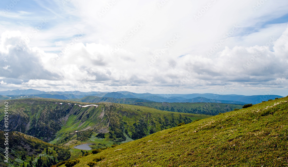 Obraz premium Summer mountain landscape. View of the hills and meadows on Lake Baikal, Russia