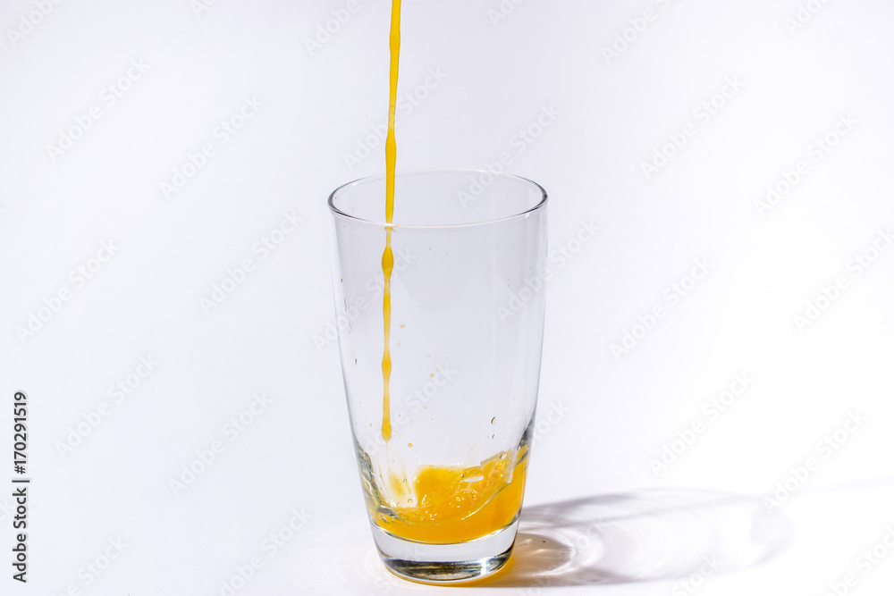 splashing orange juice with oranges against white background By showcake