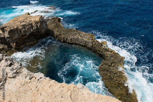 Blue hole and the collapsed Azure window. Gozo, Malta photo