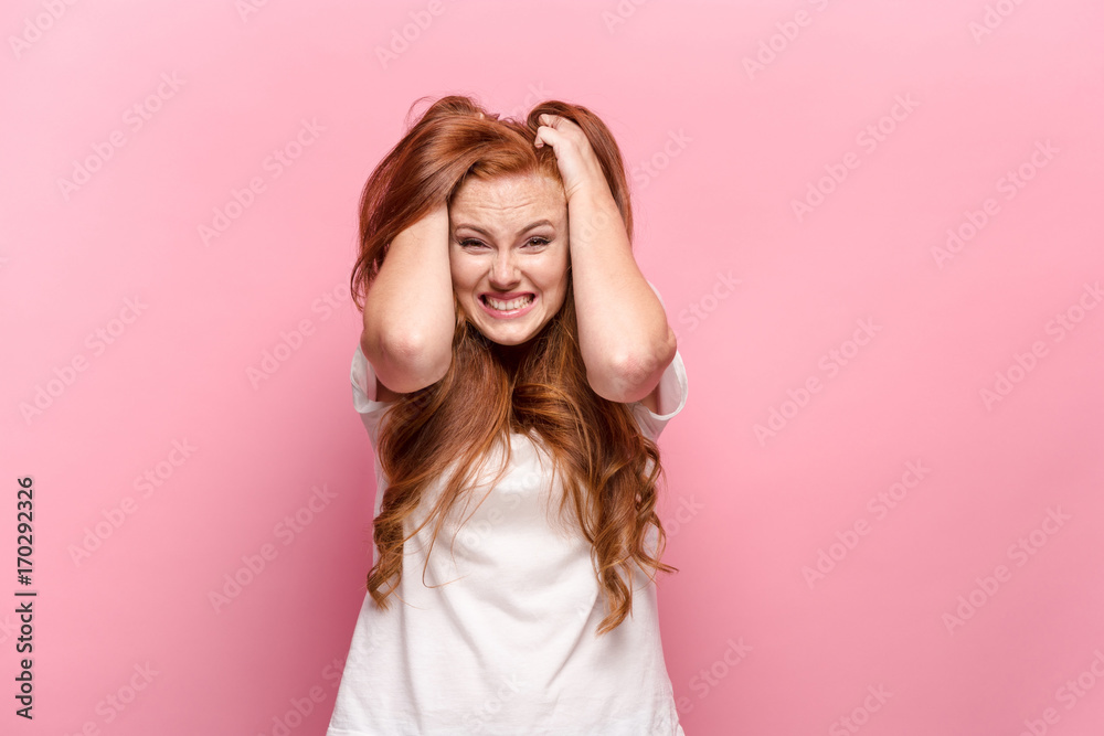 The beautiful woman is offended on pink studio The beautiful woman is offended on pink studio
