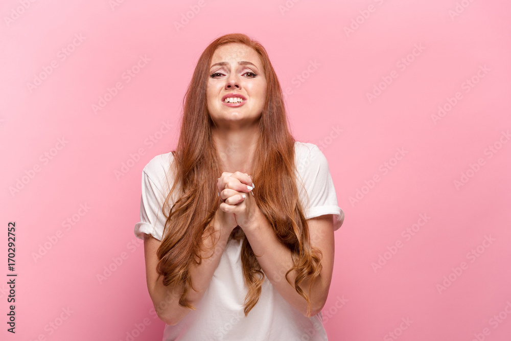 The beautiful woman is offended on pink studio The beautiful woman is offended on pink studio