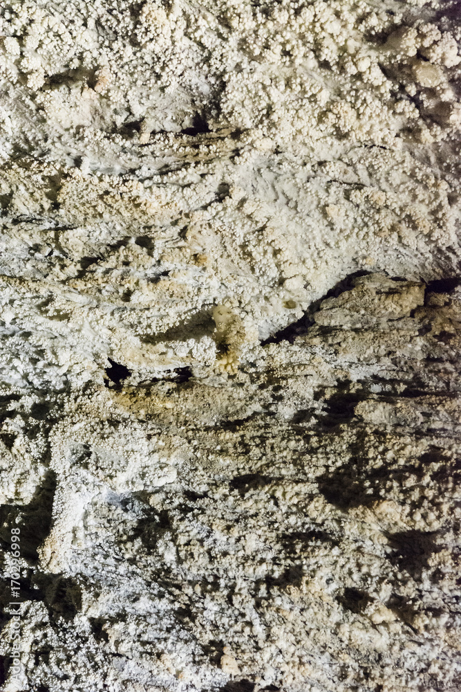 The crystals of aragonite on the wall of the cave. The crystals of aragonite on the wall of the cave.