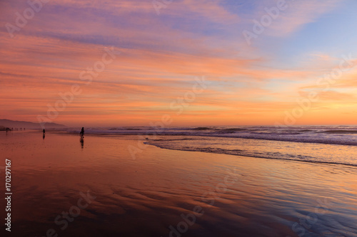 blue, pink, and purple sky at ocean beach sunset