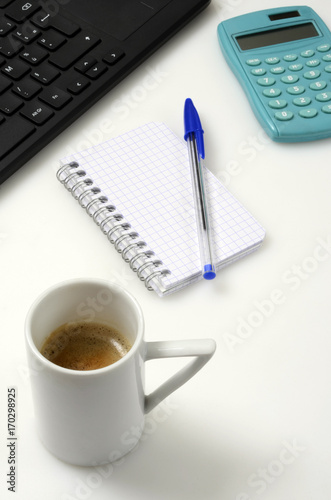 Office : PC keyboard, notebook, calculator and coffee cup