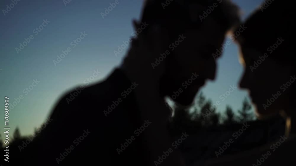 Young lovely couple hugging silhouette slowmotion Young lovely couple hugging silhouette slowmotion
