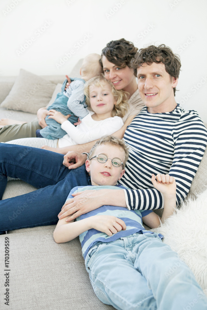 Portrait of happy family with three children