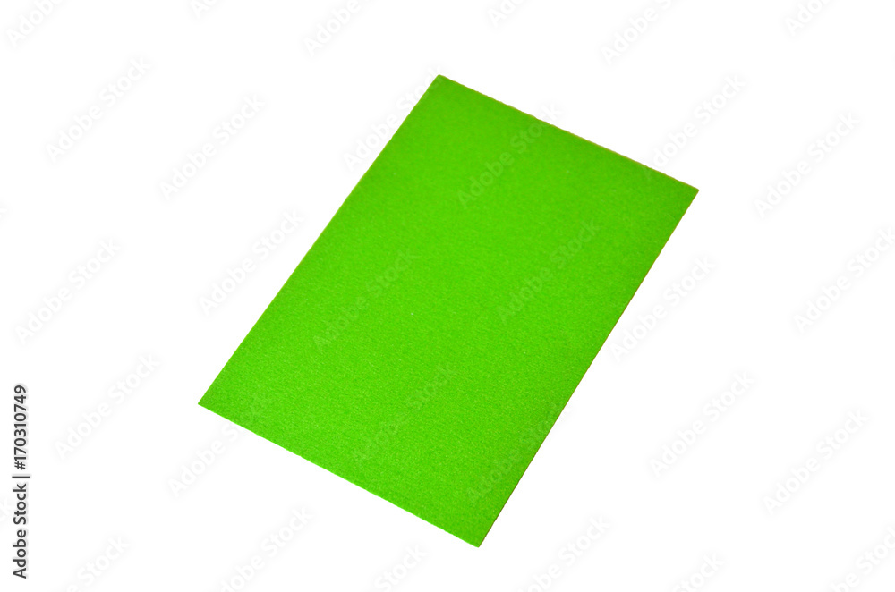 Green colored note paper shot on white background. Green colored note paper shot on white background.