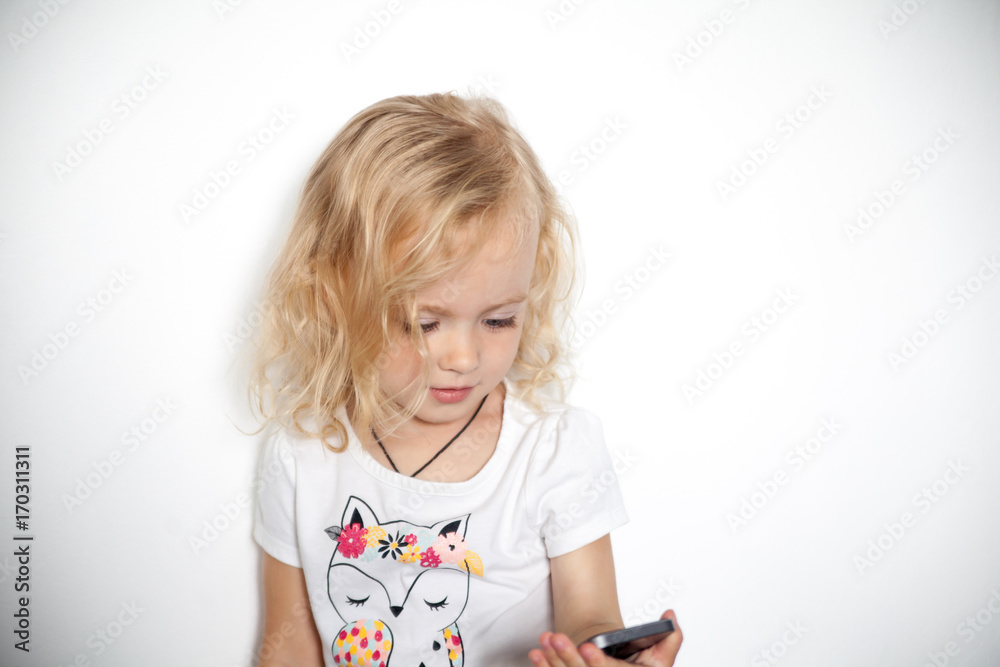 Little beautiful girl with her smart phone Little beautiful girl with her smart phone